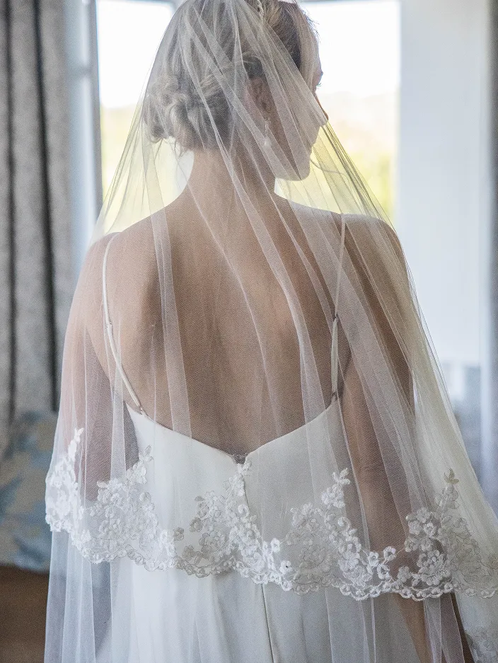 The back of the bride with a veil on a Wedding day. Wedding photography
