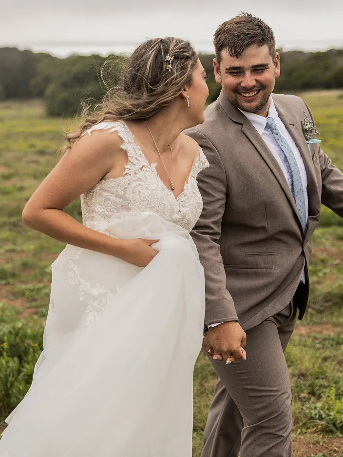 Newly Wed Couple holding hands