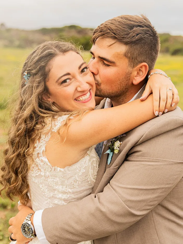 Newly Wed Couple hugging and kissing