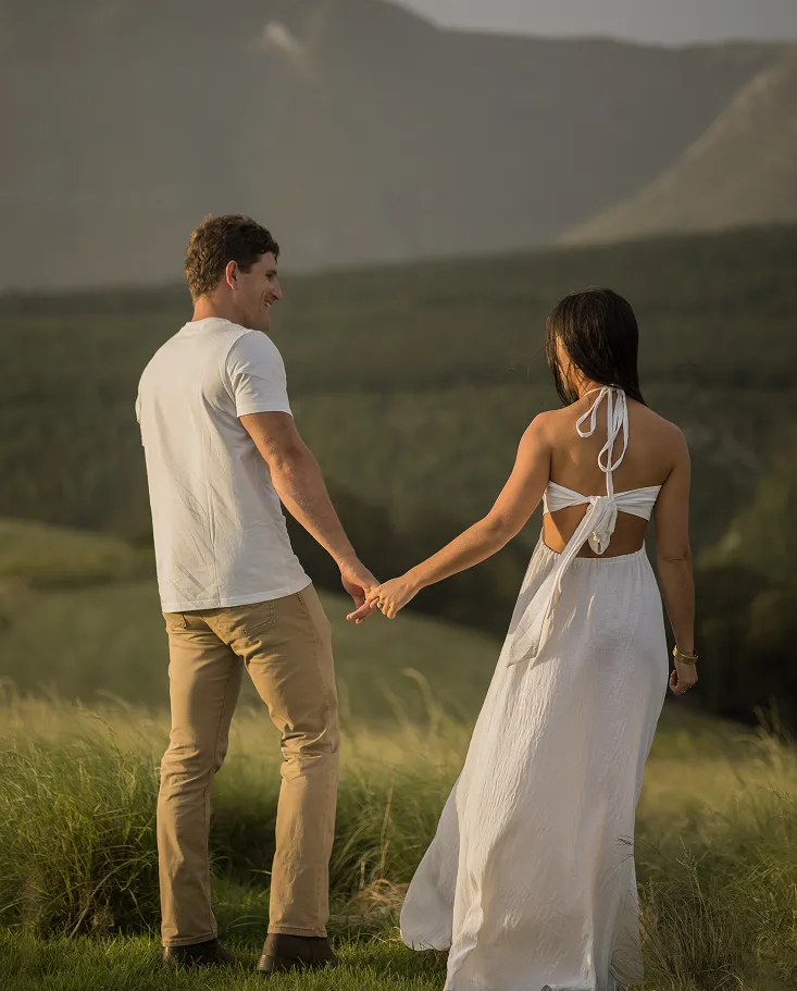 Couple Holding hands in the mountain