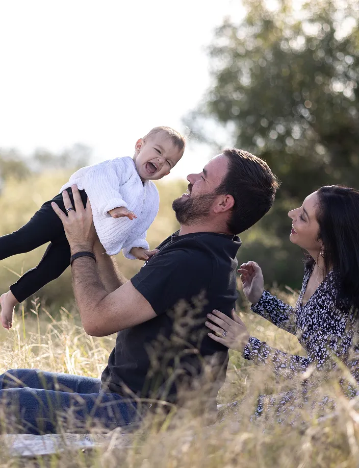 Father holding newborn child