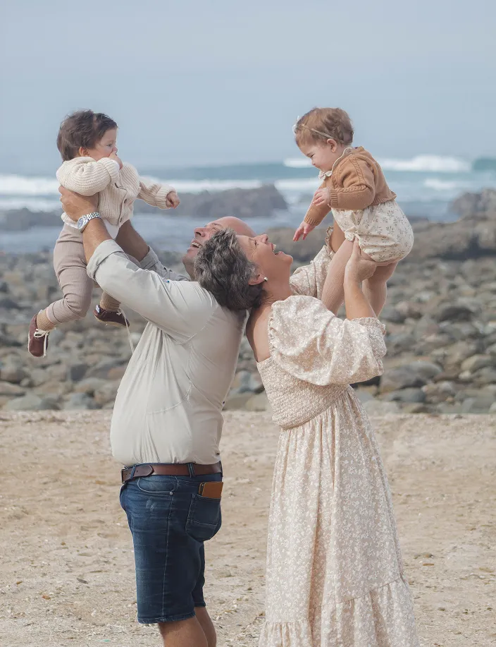 Two Family members holding two Newborn